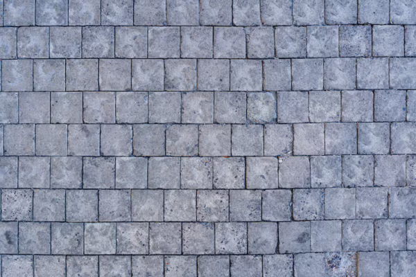 cobblestone-pavement-road-with-edge-courses-sidewalk-texture_158595-6389